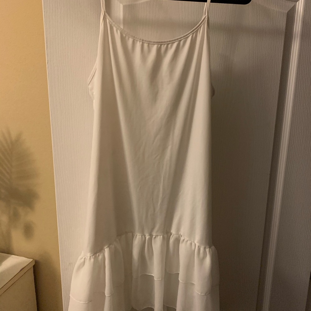 Long white ruffled tank